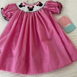 Beautiful smocked Minnie Mouse dress NWT .perfect for pics, Disney World trip.